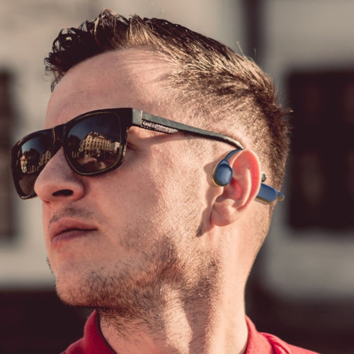 Bone conduction Bluetooth wireless headset with titanium ear hook, USB-C charging port, and lightweight waterproof design