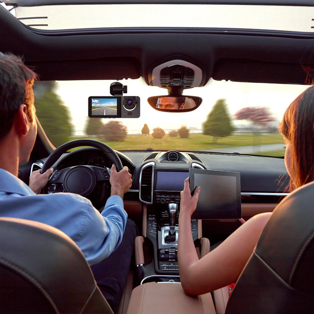 Driver and passenger in a car with the dash cam mounted on the windshield